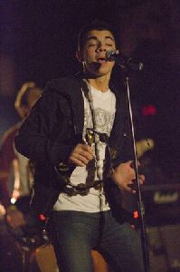 Joe Jonas singing on stage