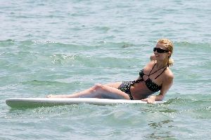 Sexy Paris Hilton in bikini surfing pictures