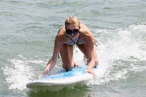 Sexy Paris Hilton in bikini surfing pictures