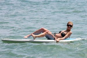 Sexy Paris Hilton in bikini surfing pictures