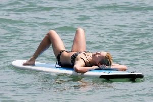 Sexy Paris Hilton in bikini surfing pictures