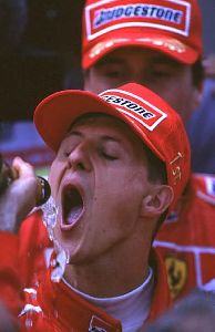 Formula One driver Michael Schumacher pictures drink champagne