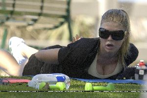 Singer Fergie doing some exercise pictures