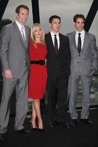 Hayden Pantyairs picture/pic at a photocall in London today wearing a red dress