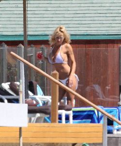 Sexy Pamela Anderson white bikini picture at her Malibu beach house