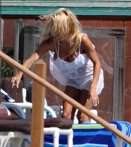 Sexy Pamela Anderson white bikini pictures at her Malibu beach house