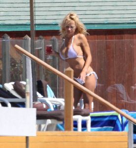 Sexy Pamela Anderson white bikini pictures at her Malibu beach house