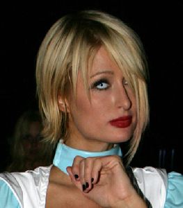 Sexy Paris Hilton pictures wearing as Alice in Wonderland at the Playboy Halloween party