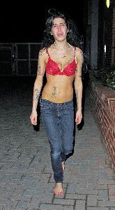 Amy Winehouse pictures walking outside in her red bra, barefoot, and crying