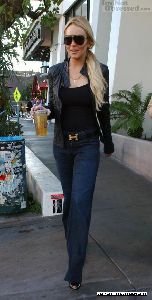 Sexy Lindsay Lohan wearing a black Leggings with black boots pictures