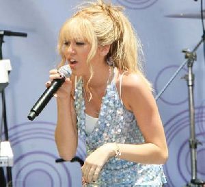 Miley Cyrus performs on stage as Hannah Montana