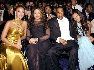 beyonce knowles in a glam yellow dress and her husband Jay-z