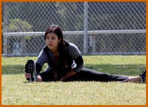 Kim Kardashian working out some morning stretches on April 20th 2008