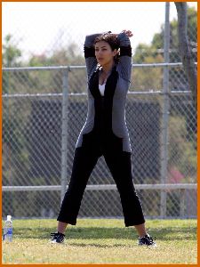 Kim Kardashian working out some morning stretches on April 20th 2008