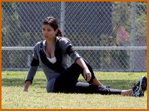 Kim Kardashian working out some morning stretches on April 20th 2008