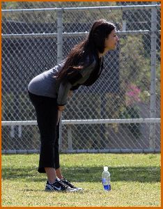 Kim Kardashian working out some morning stretches on April 20th 2008