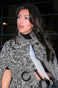 kim kardashian wearing a black and white printed coat in New York on October 31st, 2008