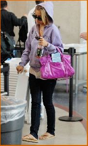 Lauren Conrad : Lauren Conrad in c-thru tank top under a purple hoodie at LAX airport5 4885dae553cf5