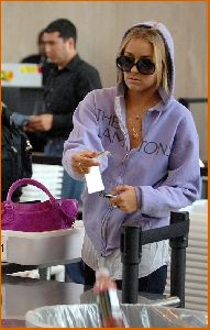 Lauren Conrad : Lauren Conrad in c-thru tank top under a purple hoodie at LAX airport8 4885dae559ebd