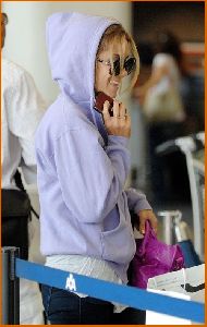 Lauren Conrad : Lauren Conrad in c-thru tank top under a purple hoodie at LAX airport4 4885dae551dad