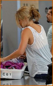 Lauren Conrad : Lauren Conrad in c-thru tank top under a purple hoodie at LAX airport9 4885dae55be06