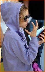 Lauren Conrad : Lauren Conrad in c-thru tank top under a purple hoodie at LAX airport2 4885dae54df1e