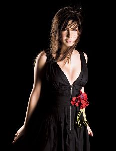 nancy ajram : black dress and a red rose