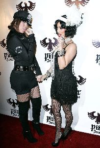 Kim Kardashian : kim kardashian feather hat costume photo at the Pur Jeans Halloween Bash 2008