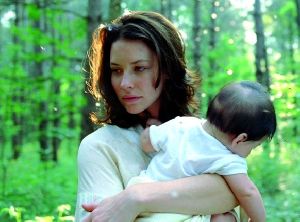 Evangeline Lilly : photo of evi with a baby from the upcoming movie afterwards - November 2008