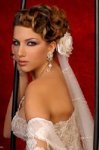 Dana Halabi : in a wedding dress modeling