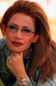 Diana Haddad : diana old photo red hair and weaing glasses