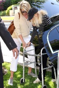 Christy Brinkley : helps her mother get into their apartment in Beverly Hills - March 2008