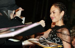 Olga Kurylenko : Olga Kurylenko signing autographs to her fans at  the Quantum of Solace movie premiere in Tokyo