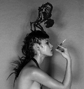 Olga Kurylenko : smoking a cigerette in black and white