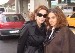 Amal Hijazi : amal hijazi with a fan on the street