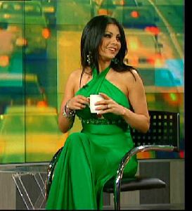 Haifa Wehbe : rotana TV interview with hala sarhan, haifa is wearing a green long dress