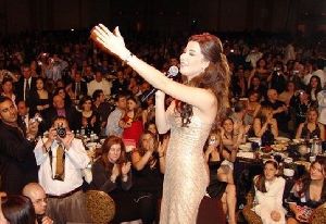 Nancy Ajram : singing to her audience at a private hotel party