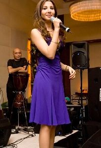 Nancy Ajram : in a stunning deep purple dress in a private party