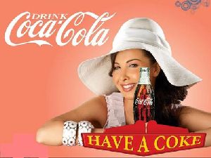 Nancy Ajram : nancy white hat in the coco cola printed ad poster