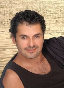 Ragheb Alama : wearing a black top