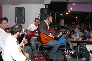 Hani Mitwasi : Hani Mitwasi on his guitar singing in a cafe in amman jordan September 2008