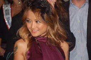 Tila Tequila Arrives at the Supermodels Unlimited Magazine Party on November 12th 2008, she looks very elegant in the purple dress