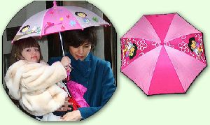 Suri Cruise : Suri is in love with her new pink dora umbrella