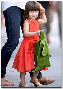 Suri Cruise : the lime green jacket seems to go perfectly with her orange junior GAP dress