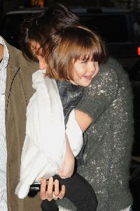 Suri Cruise : Suri Cruise rolled in her white blanket with her mom Katie Holmes arrive back at their Manhattan residence Yesterday 16th December, 2008