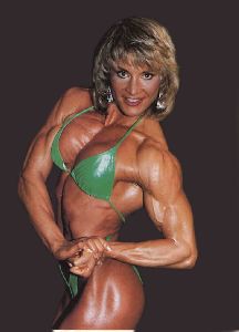 Cory Everson : Cory Everson in a green outfit that shows her muscles