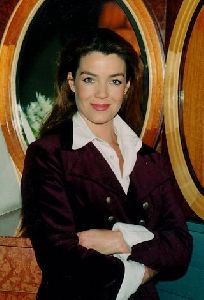 Claudia Christian : Claudia Christian in a dark purple jacket