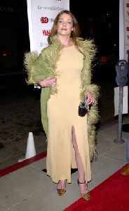 Claudia Christian : looks stunning on the red carpet with that feathery green coat