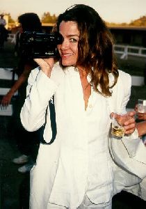 Claudia Christian : Claudia Christian with a camera in her hand