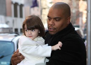 Suri Cruise : Suri Cruise leaves home with a bodyguard in New York City while her mum Katie Holmes birthday was celebrating her 30th birthday with friends - 19th, Dec. 2008